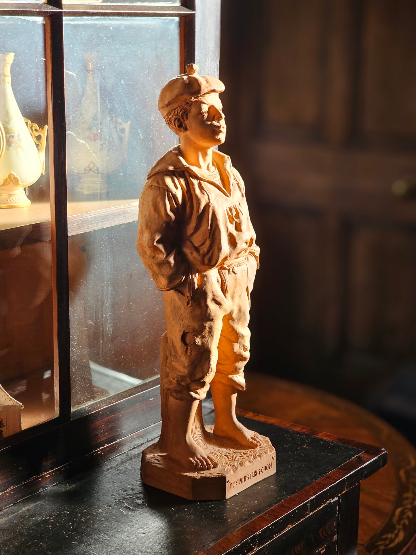 Terracotta figure George Johnson "The Whistling Coon" by Watcombe Pottery Co