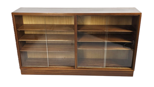 mid-century bookcase with four sliding glass doors