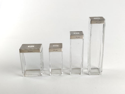 silver topped  vanity bottles