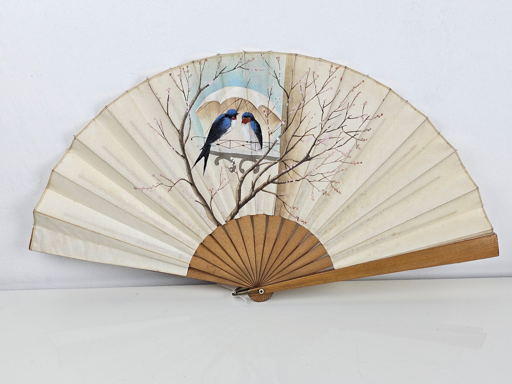 Vintage handheld fan with Swallows