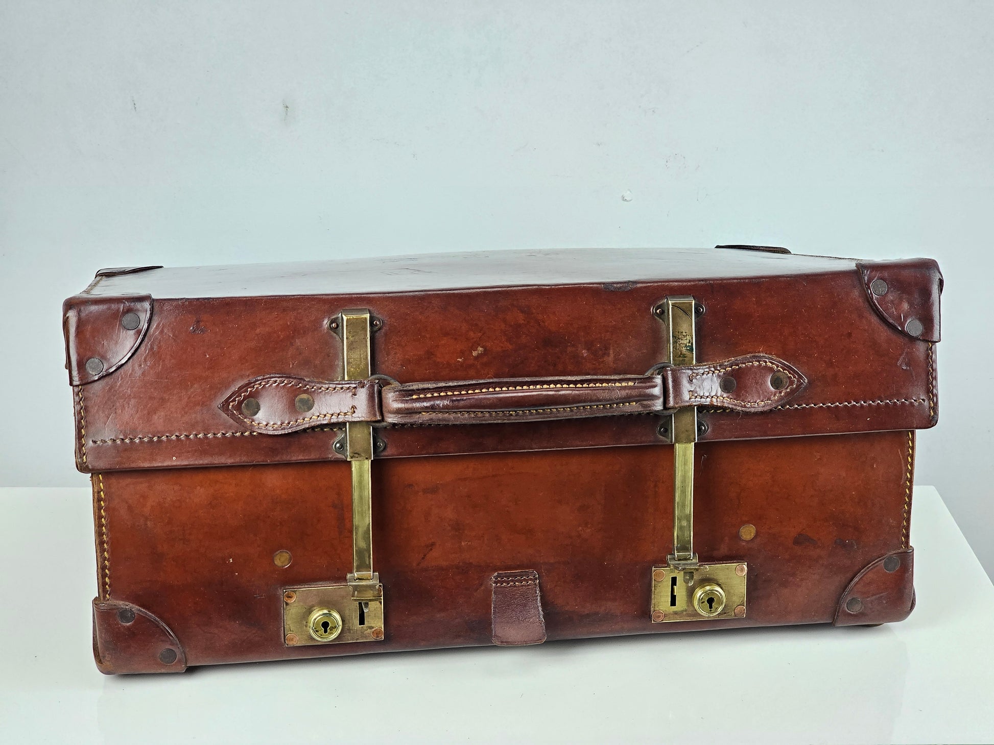 antique expanding leather suitcase